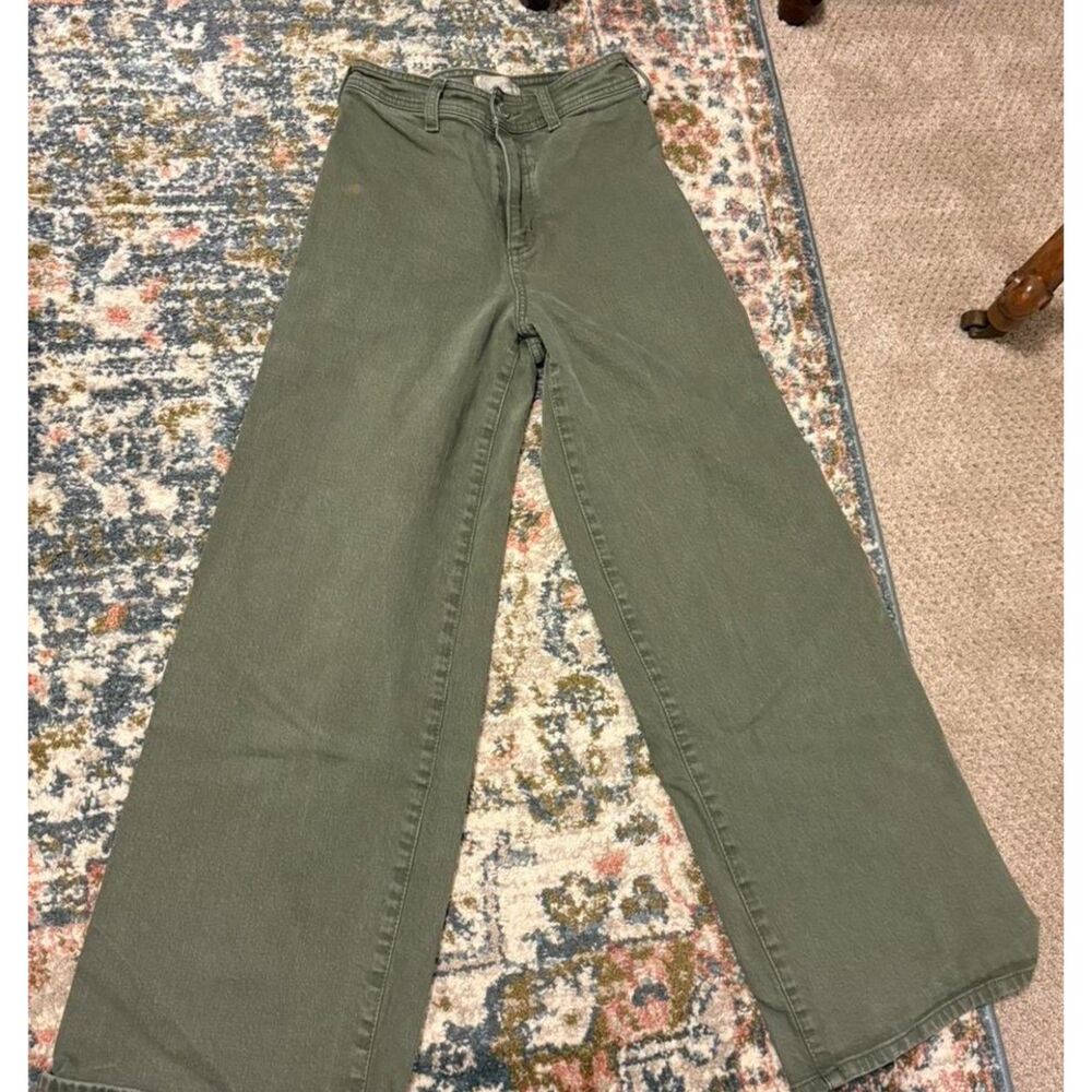 High-waisted, green wide-leg jeans with a relaxed fit.